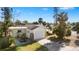 Yellow single-story house with garage and a fenced yard at 7825 Gulf Blvd, St Pete Beach, FL 33706