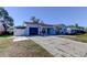 Light blue house with a two car driveway at 8240 Greenleaf Cir, Tampa, FL 33615