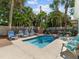 Inviting pool area with lounge chairs and BBQ grill at 843 Eldorado Ave, Clearwater Beach, FL 33767