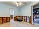 Unfinished bedroom with exposed walls and flooring, showing access to other rooms at 113 176Th W Ave, Redington Shores, FL 33708