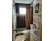 Bathroom with shower, toilet, and updated vanity at 1147 Viking Dr, Holiday, FL 34691