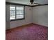 Bright bedroom with a window overlooking the pool at 1147 Viking Dr, Holiday, FL 34691
