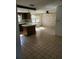Kitchen features tile flooring and a breakfast bar at 1147 Viking Dr, Holiday, FL 34691