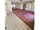 Spacious living room with tiled and carpeted floors at 1147 Viking Dr, Holiday, FL 34691