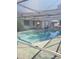 View of the kidney shaped swimming pool from another angle at 1147 Viking Dr, Holiday, FL 34691
