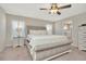 Main bedroom features a king bed, updated flooring, and ensuite bath at 11935 Stone Pine St, Riverview, FL 33569