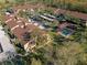 Aerial view showing building complex, parking, and landscaping at 13608 S Village Dr # 6105, Tampa, FL 33618