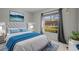 Comfortable bedroom with large window, stylish decor, and ample lighting at 13608 S Village Dr # 6105, Tampa, FL 33618