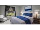 Cozy bedroom featuring a large window for natural light and well-chosen decor at 13608 S Village Dr # 6105, Tampa, FL 33618