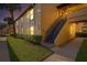 Exterior view of building with staircase and well-maintained landscaping at 13608 S Village Dr # 6105, Tampa, FL 33618
