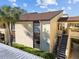 Two-story building with stairs and covered parking at 13608 S Village Dr # 6105, Tampa, FL 33618
