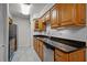 Well-appointed kitchen with wood cabinets and stainless steel appliances at 13608 S Village Dr # 6105, Tampa, FL 33618