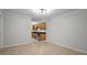 Spacious living room leading to kitchen, featuring a modern light fixture at 13608 S Village Dr # 6105, Tampa, FL 33618