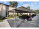 Exterior of condo complex with assigned parking and a mature landscaping at 13608 S Village Dr # 6105, Tampa, FL 33618