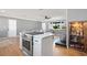 Kitchen island with a built-in cooktop and stainless steel oven at 2791 63Rd N St, St Petersburg, FL 33710