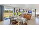 Bright dining area with sliding glass doors and a farmhouse table at 3511 Rosewood Ramble Ct, Plant City, FL 33565