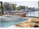 Pool area with spa and fire pit overlooking the marina at 344 Capri Blvd, Treasure Island, FL 33706