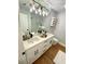 Elegant bathroom features a double vanity, quartz countertop, and modern lighting at 4125 W Arch St, Tampa, FL 33607