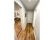 Bright hallway with wood-look floors and access to other rooms at 4125 W Arch St, Tampa, FL 33607