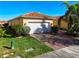 House exterior showcasing a white garage door and well-manicured lawn at 4845 Marble Springs Cir, Wimauma, FL 33598