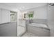 Spa-like bathroom with soaking tub and walk-in shower at 747 Brightwaters Ne Blvd, St Petersburg, FL 33704
