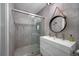 Modern bathroom with double vanity, walk-in shower, and stylish mirror at 747 Brightwaters Ne Blvd, St Petersburg, FL 33704