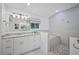 Spa-like bathroom with soaking tub, walk-in shower, and double vanity at 747 Brightwaters Ne Blvd, St Petersburg, FL 33704