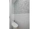 Modern powder room with gray and white tile at 747 Brightwaters Ne Blvd, St Petersburg, FL 33704