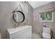 Modern bathroom with double vanity, walk-in shower, and stylish mirror at 747 Brightwaters Ne Blvd, St Petersburg, FL 33704