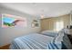 Bright bedroom with two twin beds, hardwood floors, and beachy decor at 747 Brightwaters Ne Blvd, St Petersburg, FL 33704
