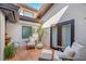 Relaxing courtyard with seating area, fountain, and lush plants at 747 Brightwaters Ne Blvd, St Petersburg, FL 33704