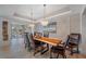 Elegant dining room with live edge table and crystal chandeliers at 747 Brightwaters Ne Blvd, St Petersburg, FL 33704