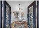 Bright entryway with marble floors, ornate doors, and a statement rug at 747 Brightwaters Ne Blvd, St Petersburg, FL 33704