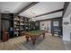 Game room with pool table, built-in shelving, and high ceilings at 747 Brightwaters Ne Blvd, St Petersburg, FL 33704