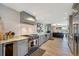 Gourmet kitchen with stainless steel appliances and granite countertops at 747 Brightwaters Ne Blvd, St Petersburg, FL 33704
