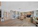 Spacious living room with hardwood floors, comfortable seating, and access to water views at 747 Brightwaters Ne Blvd, St Petersburg, FL 33704