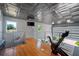 Upper-level loft area with hardwood floors and exercise equipment at 747 Brightwaters Ne Blvd, St Petersburg, FL 33704