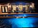 Inviting pool and spa at night with exterior lighting at 747 Brightwaters Ne Blvd, St Petersburg, FL 33704