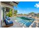 Relaxing pool area with patio furniture and tranquil waterfront views at 747 Brightwaters Ne Blvd, St Petersburg, FL 33704