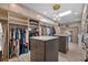 Luxurious walk-in closet with dual islands and custom organizers at 747 Brightwaters Ne Blvd, St Petersburg, FL 33704