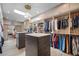 Luxurious walk-in closet with dual islands and custom organizers at 747 Brightwaters Ne Blvd, St Petersburg, FL 33704