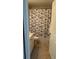 Bathroom with shower/tub combo and patterned curtain at 8003 Bally Money Rd, Tampa, FL 33610