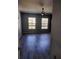 Spacious bedroom with gray vinyl plank flooring and ceiling fan at 8003 Bally Money Rd, Tampa, FL 33610