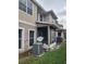 Exterior view showing building and screened porch at 8003 Bally Money Rd, Tampa, FL 33610