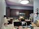 Modern kitchen featuring dark wood cabinets, microwave, and stove at 8003 Bally Money Rd, Tampa, FL 33610