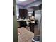 Modern kitchen with stainless steel appliances and dark brown cabinets at 8003 Bally Money Rd, Tampa, FL 33610