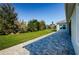 Large backyard with grassy area and paver patio at 8319 Swiss Chard Cir, Land O Lakes, FL 34637