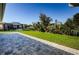 Paver patio overlooks well-maintained lawn, and a fenced pool at 8319 Swiss Chard Cir, Land O Lakes, FL 34637
