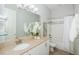 Bright bathroom featuring a stylish vanity, tiled shower, and modern fixtures for a relaxing retreat at 8319 Swiss Chard Cir, Land O Lakes, FL 34637