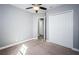 Spacious bedroom with double door closet and neutral color scheme at 8319 Swiss Chard Cir, Land O Lakes, FL 34637